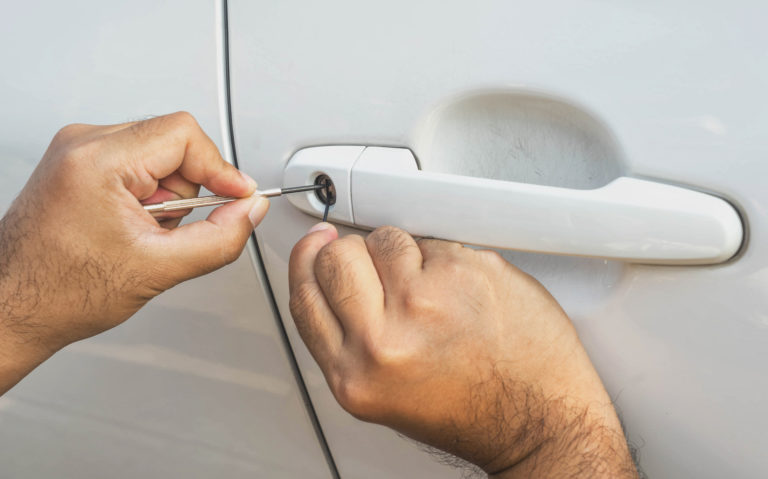 car door unlocking with lock pick automotive locksmith in cleveland, oh.